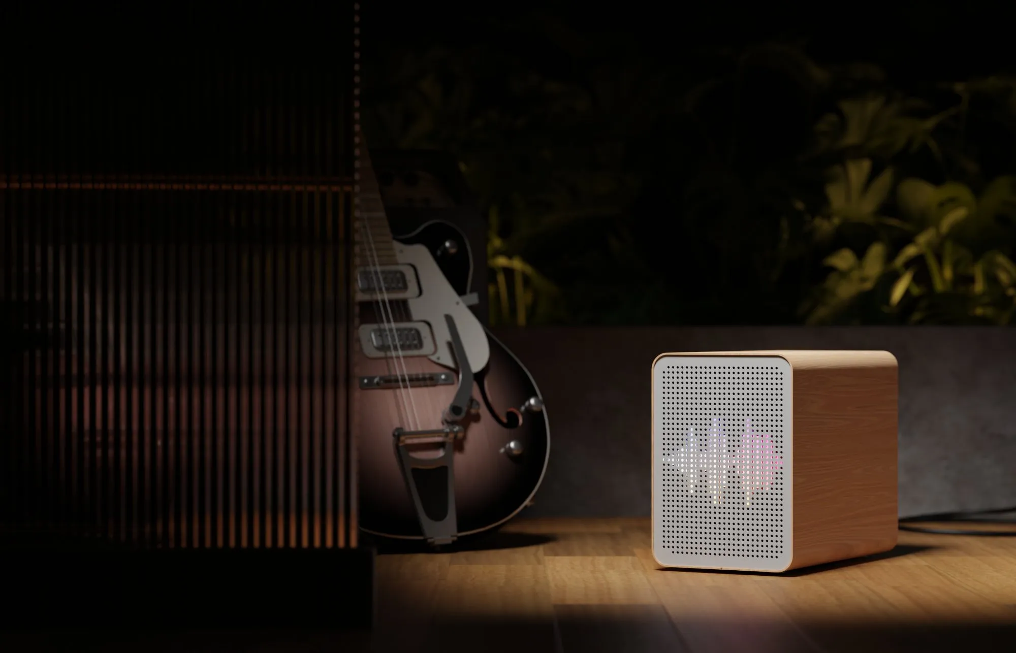 The UPS beside a guitar at night