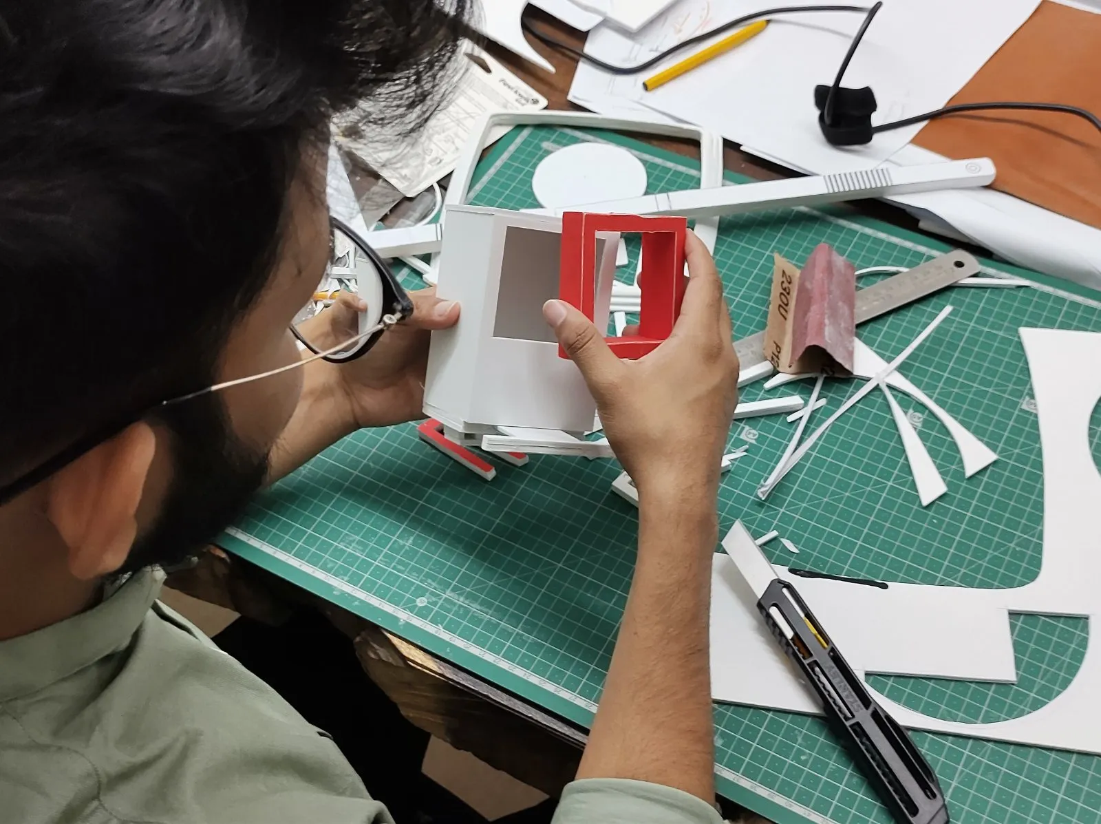 Cutting paper models in the workshop