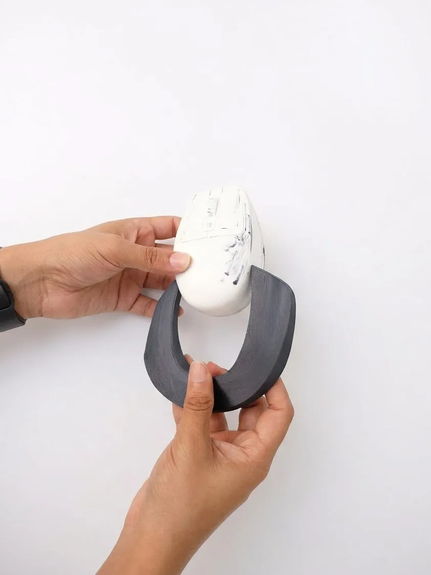 V1 prototype in hand with the ergo grip